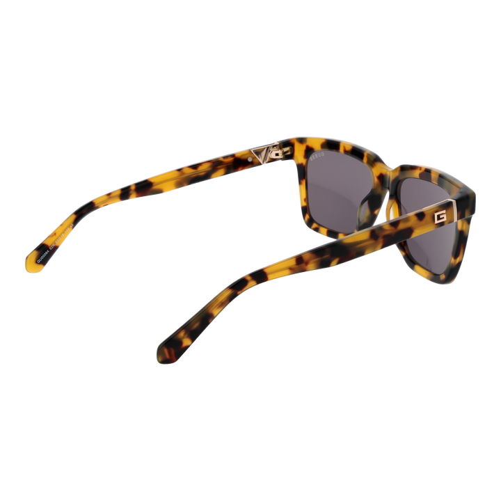 Unisex tortoiseshell square sunglasses in brown-yellow pattern with dark lenses and logo on temple