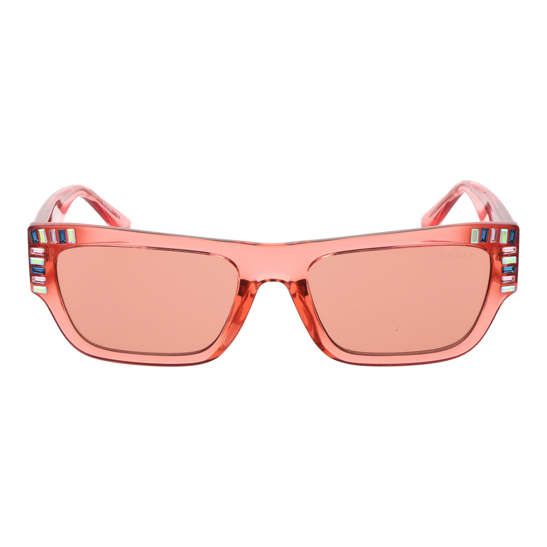Translucent pink rectangular Guess sunglasses with decorative stones on corners and UV400 lenses on white background