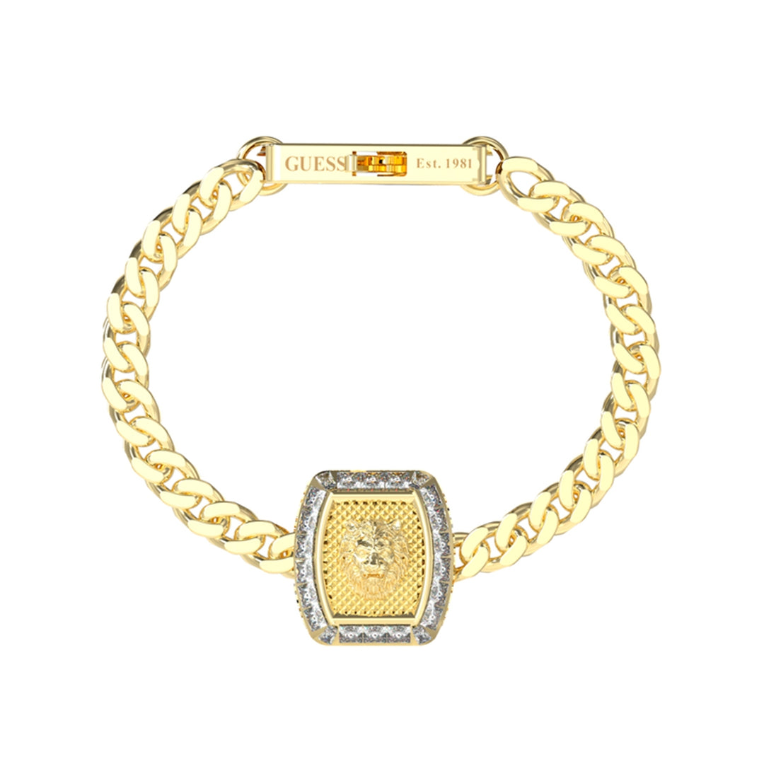 Chunky gold chain bracelet with lion head emblem and gemstone border on a neutral background