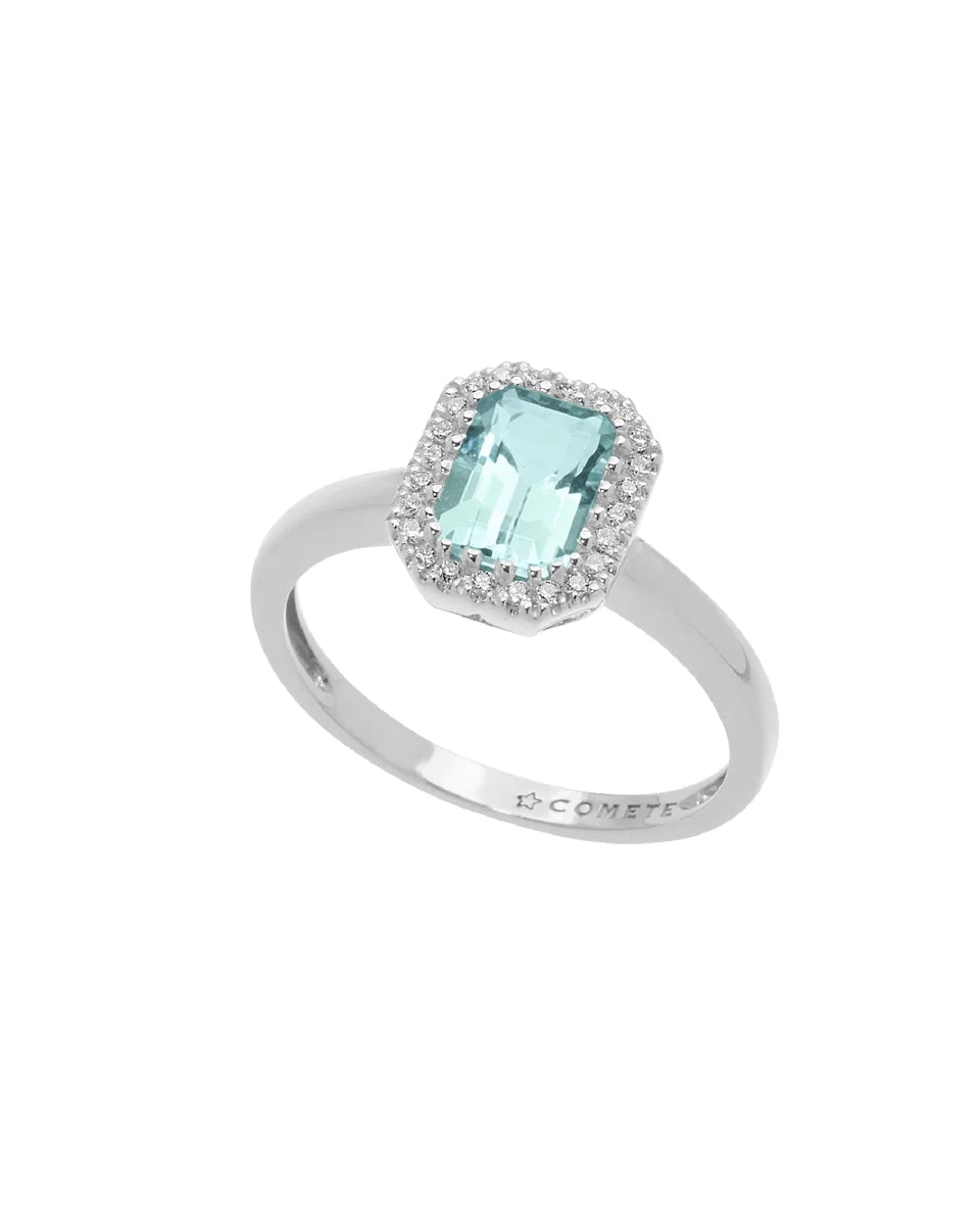 Silver ring with light-blue central gemstone surrounded by a halo of small sparkling stones
