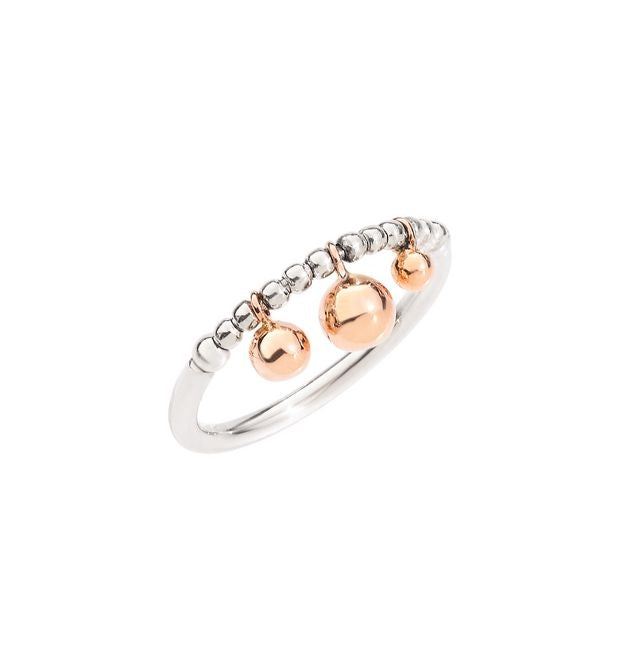 Close-up of beaded sterling silver ring with dangling rose gold spheres on modern background
