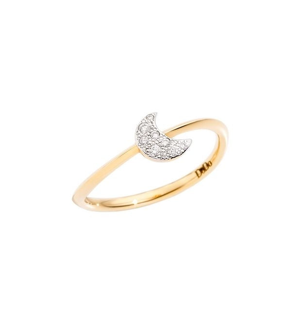 Close-up gold and silver ring with crystal-embedded crescent moon on a white background