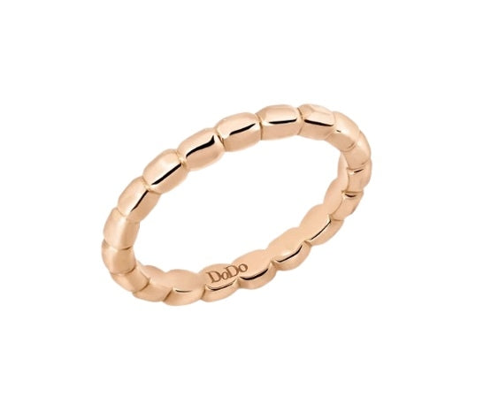 Rose gold beaded stacking ring for Women shown on neutral background, close-up of polished beads