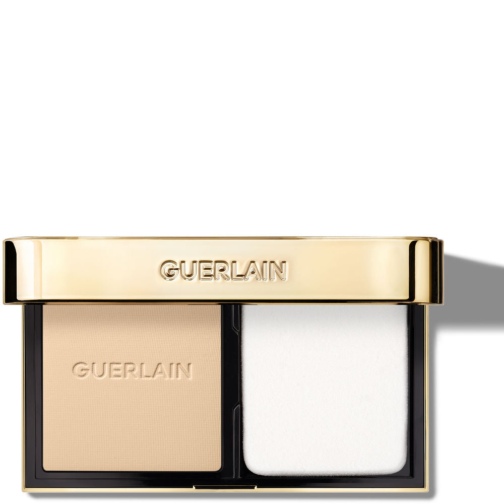 Compact powder foundation in black case, 10 g, gold‑infused pressed powder