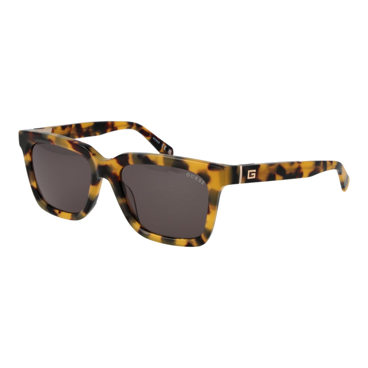 Unisex tortoiseshell square sunglasses in brown-yellow pattern with dark lenses and logo on temple