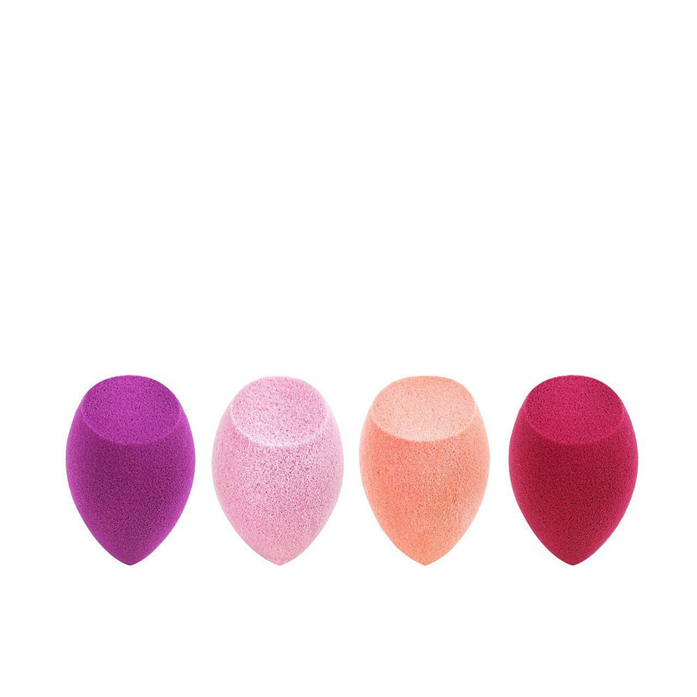 Real Techniques Four teardrop makeup sponges in purple, light pink, peach and dark pink, soft porous foam texture