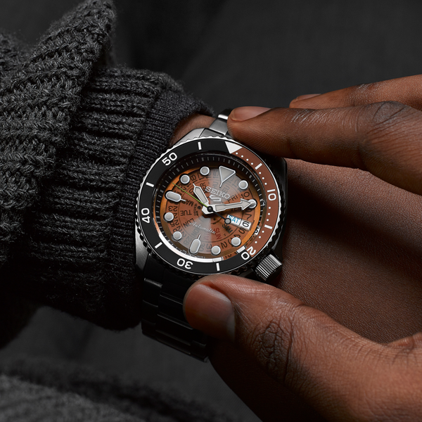 Stainless steel diver watch black dial brown strap rotating bezel luminous markers