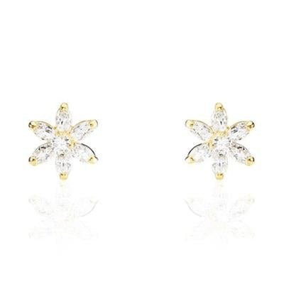Gold floral stud earrings with clear gemstone centers on polished metal petals, shown on neutral background